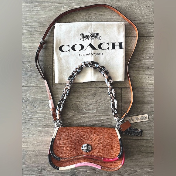 Coachtopia Handbags - Coach Pebbled Leather Colorblock Saddle Crossbody Bag - Brown/Pink